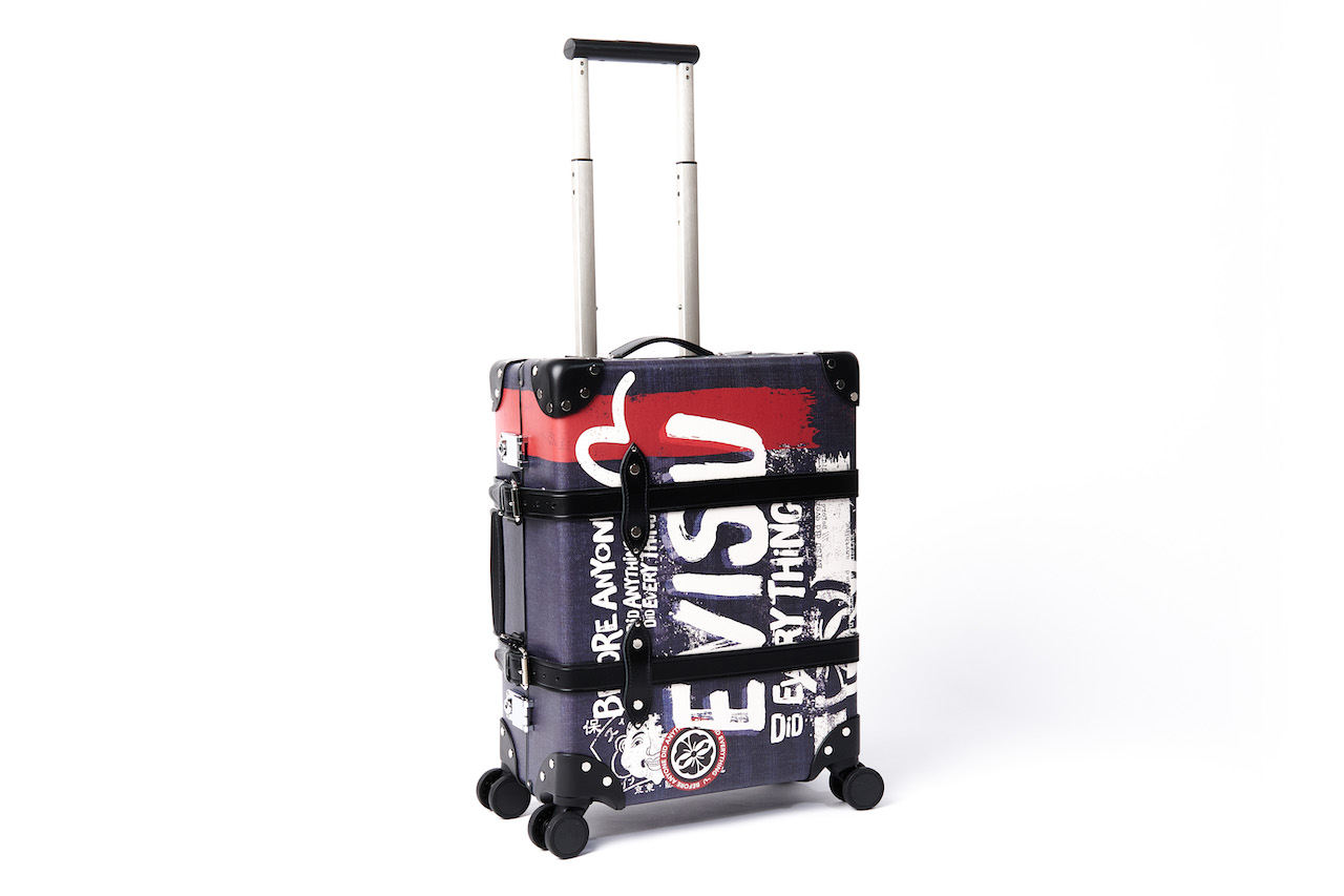 Japanese designer clothing brand EVISU creates new capsule carry-on with British luggage company Globe-Trotter.