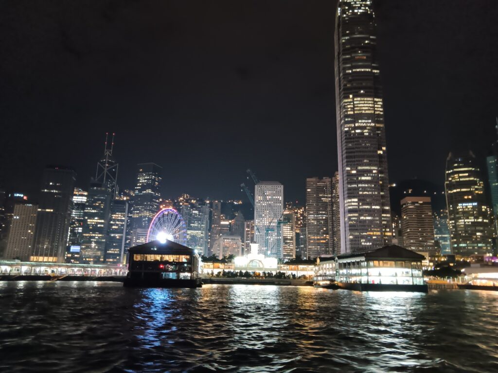 view of IFC at night from Star Ferry