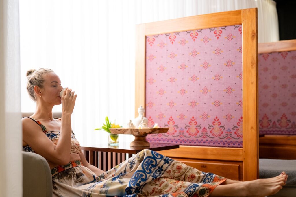 woman sipping tea at Conrad Spa Bali